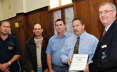 Mayor Ron Dyne (right) accepts the Matilda petition from Brendan Blatchly, with (from left) Transport Workers Union organiser Ed Taylor, victim’s family representative John Carlson and trucking safety advocates Michael Hogg and Brendan Blatchly. Mayor Ron Dyne (right) accepts the Matilda petition from Brendan Blatchly, with (from left) Transport Workers Union organiser Ed Taylor, victim’s family representative John Carlson and trucking safety advocates Michael Hogg and Brendan Blatchly.